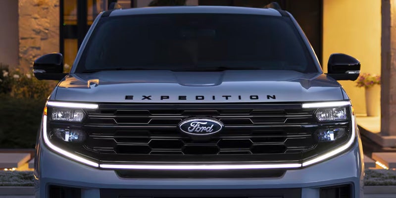 Front grille and headlights of the blue Ford SUV