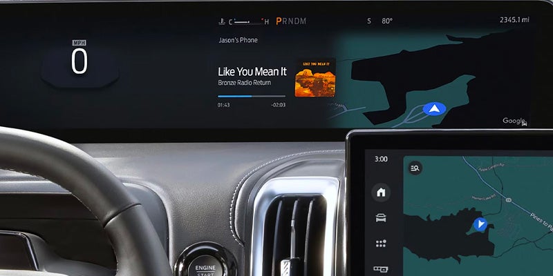 Digital dashboard displaying speed, music, and navigation maps