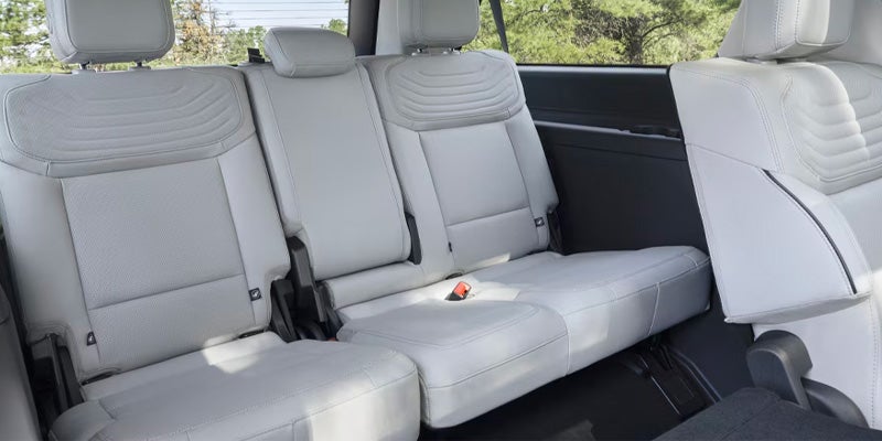 The light-colored third-row seating inside a Ford SUV