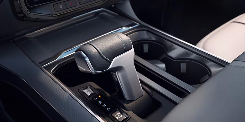 Close-up of the gear shifter and center console in a Ford F-150.